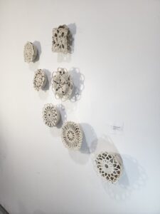 7 Round Mandala Crochet Tapestries on gallery wall