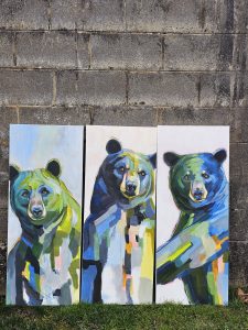 3 vertical paintings of bears with vibrant blue and green color pallete